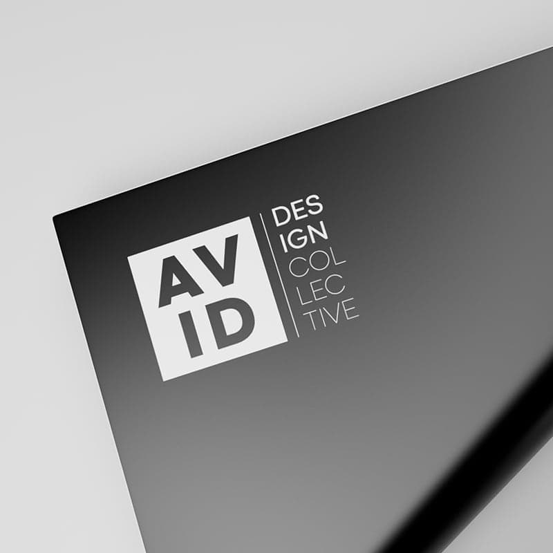 AVID Design Collective logo in white with subtle background texture