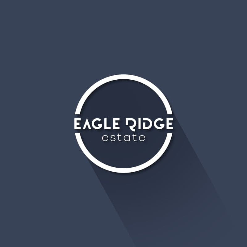 Eagle Ridge property development logo with mountain-inspired mark on dark background