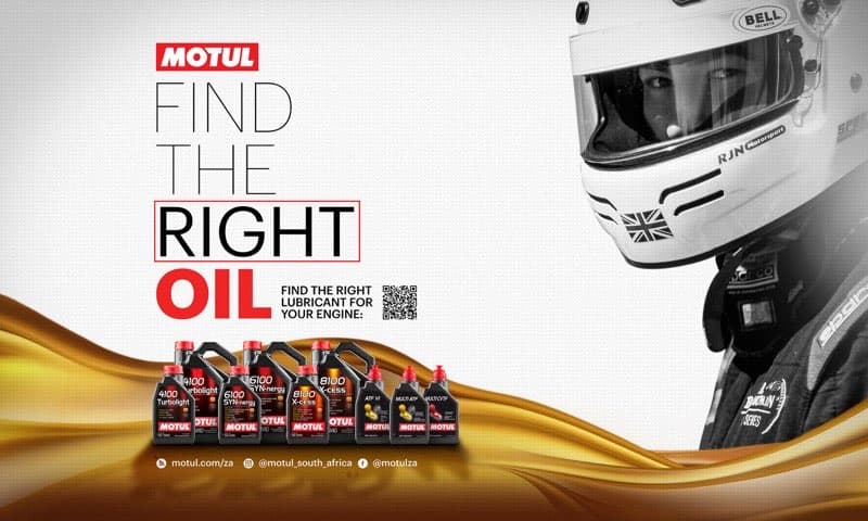 Motul workshop wall panel with desaturated racing driver, golden oil elements, and full product range