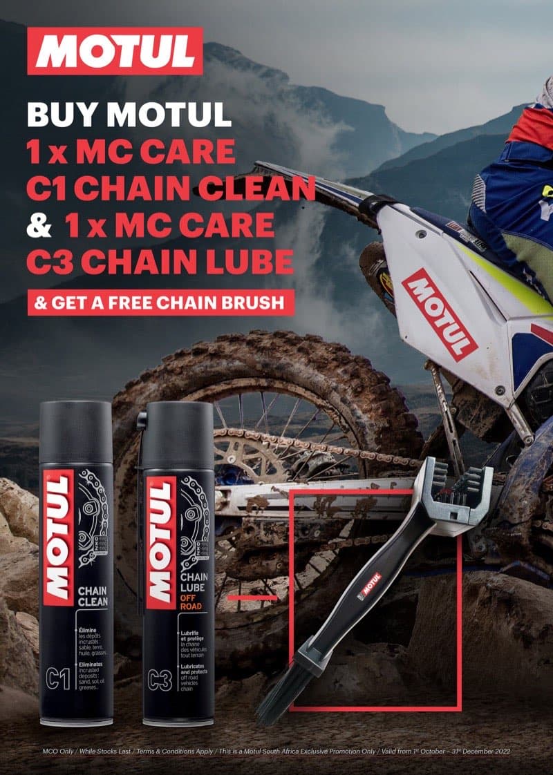 Motul MC Care chain clean and lube promotional poster with dynamic motocross rider on rocky terrain
