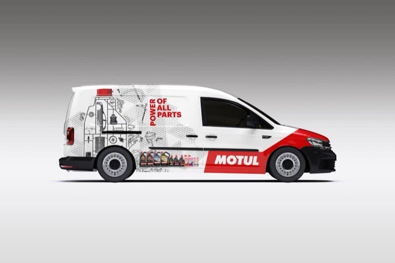 Motul VW Caddy full passenger side view showing complete wrap design with technical illustrations and product imagery