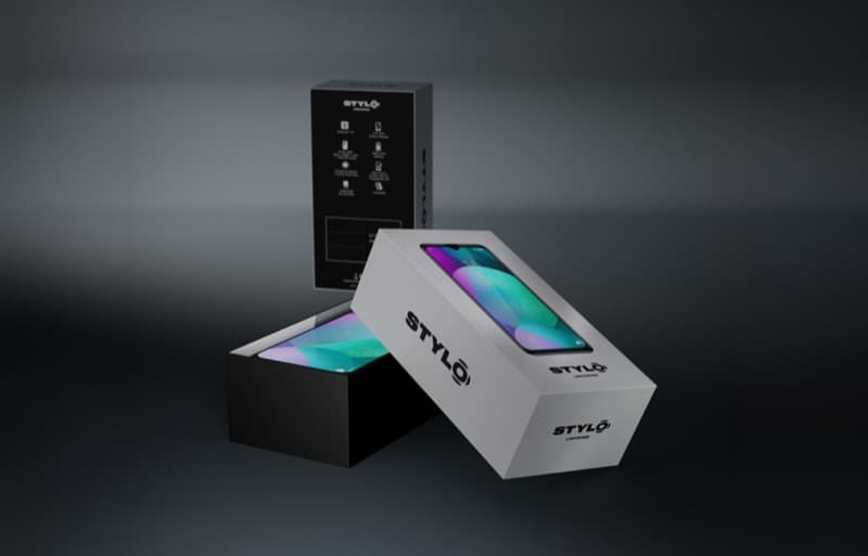 Stylo Universe smartphone packaging render with stacked boxes showing open lid and back panel specs