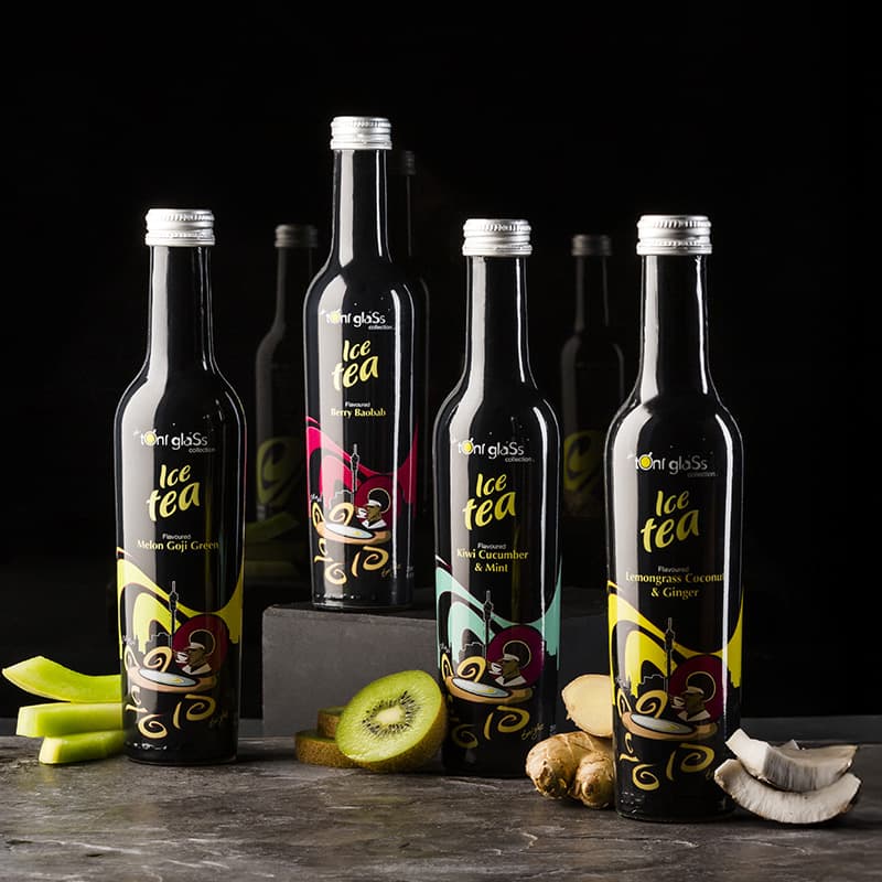 Toni Glass Ice Tea packaging design by Skilld Design. Premium black glass bottles with colourful labels and flavour ingredients