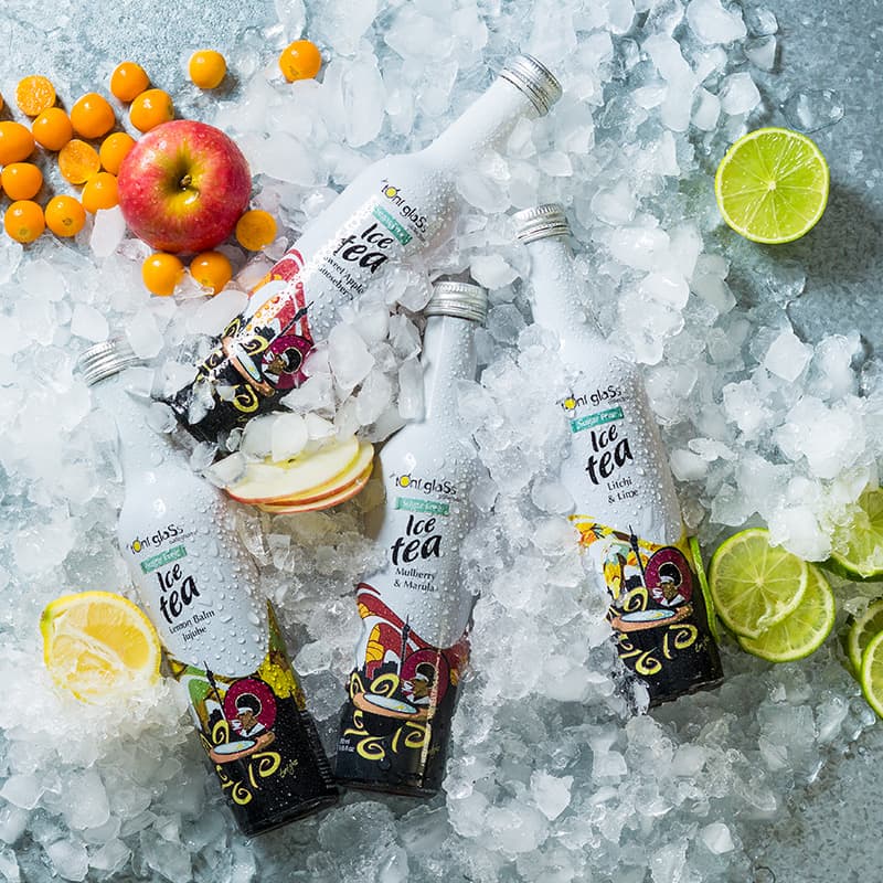 Toni Glass Sugar Free Ice Tea packaging design. White bottles on ice with fresh fruit and condensation